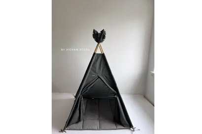 Graphite wigwam with a window and a thin gray rug